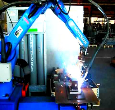 Welding robot in an industrial setting